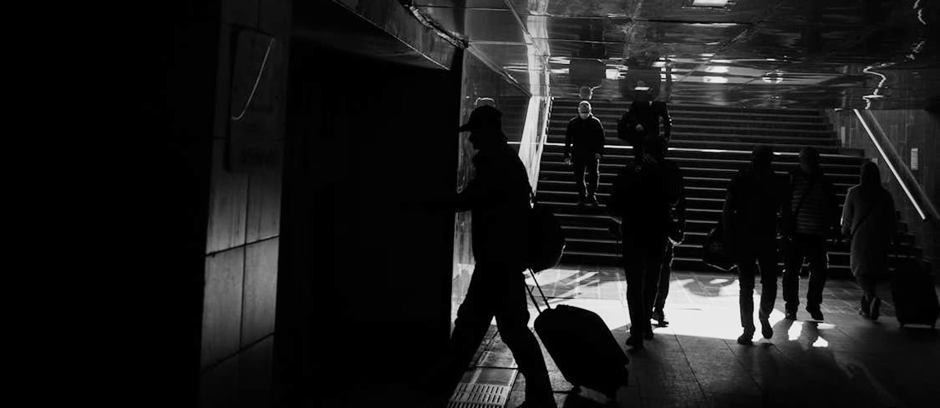 A dark, modern staircase leading downwards.
